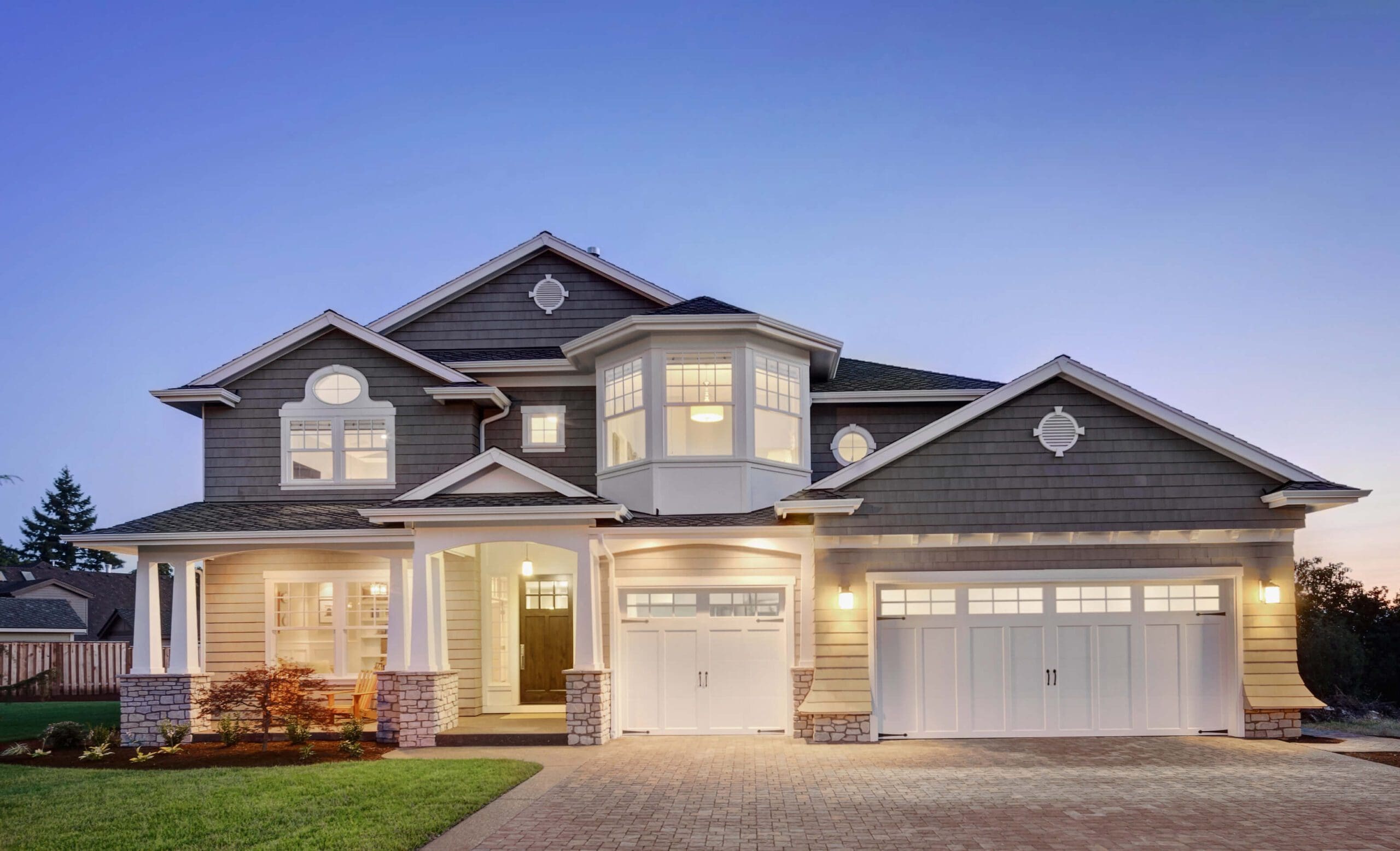 A brightly lit home with a large garage