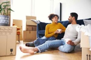 happy couple moving into home