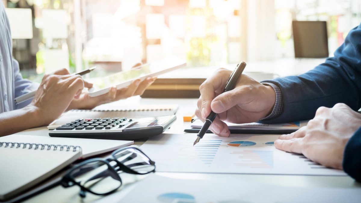 Administrator business man financial inspector and secretary making report, calculating balance. Internal Revenue Service checking document. Audit concept
