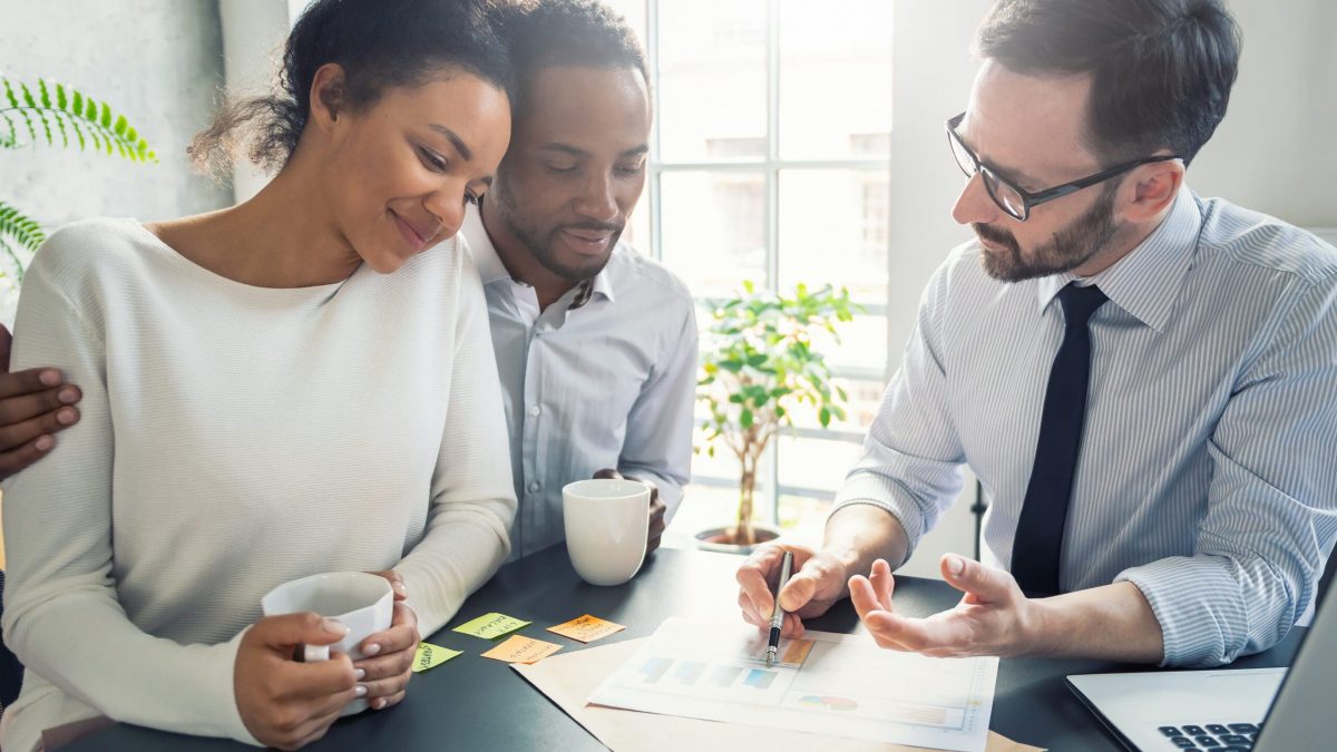 Family Couple Consultations With A Lawyer Or Insurance Agent