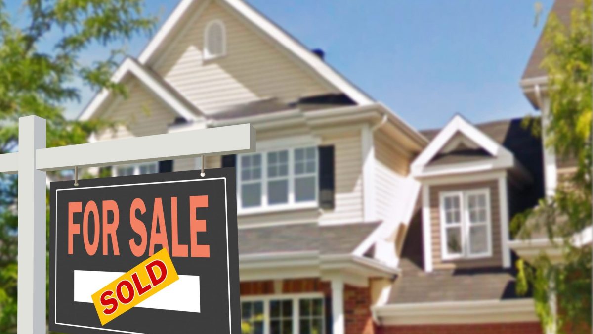 Home for sale. Sign in front of new home