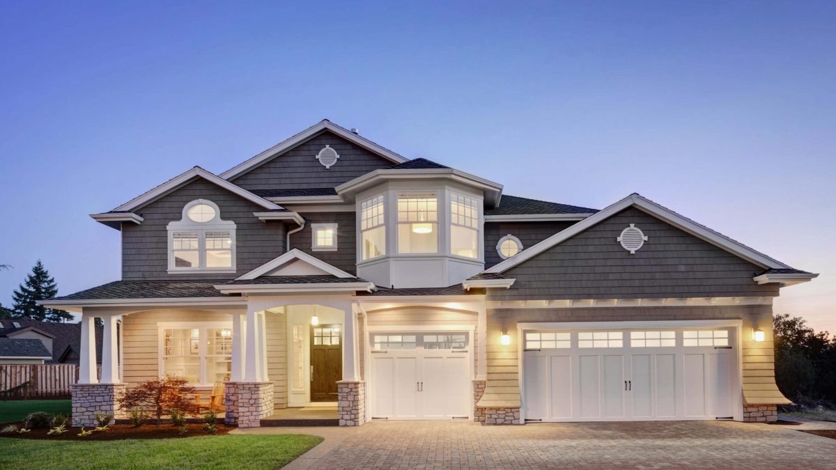 A brightly lit home with a large garage